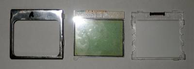 Nokia 3310 LCD with Nokia 3310 bezel and reflector ready for reassembly, top
